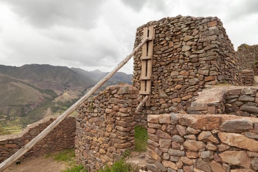 Pisac, Peru - April 4, 2014: Archaeological Park of Pisac, ruins and constructions of the ancient Inca city, near the Vilcanota river valley, Peru.