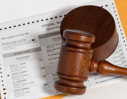Concept for problems in deciding Presidential election in the USA with judge's gavel on absentee ballot