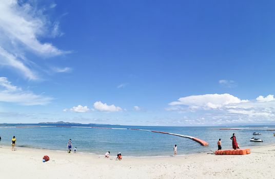 Editorial: Bangkok, Thailand, 28th Jun 2020. Thai people with social distancing at the Pattaya beach in the morning with blue sky, Thailand.