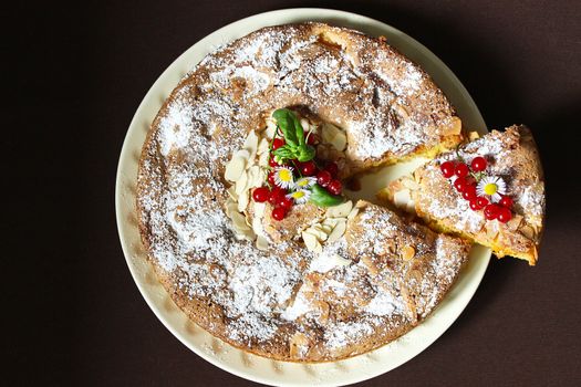 Homemade Apple pie with nuts and red currants.Texture or background