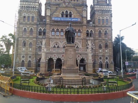 Mumbai headquarters, Fort, Mumbai, Maharashtra 400001 India. May-03-2019, tourist visiting (only outside area) for looking and enjoying the architecture of headquarters visit the place.