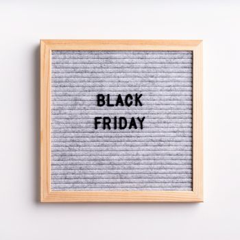 Black friday, seasonal sale concept. Text black friday on gray letter board on white background