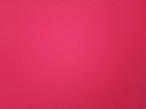 Crimson plaster wall. The background of painted wall.