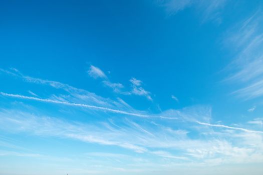 A Gorgeous Clear Blue Sky With Clouds and Contrails for Sky Replacement