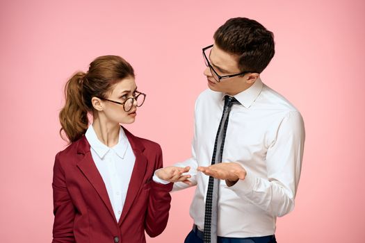 business man and woman office work colleagues team office management studio pink background. High quality photo