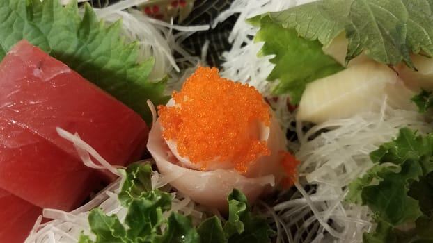 Japanese sushi with fish and orange fish eggs