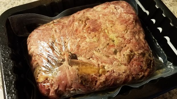 savory red meat pork in plastic bag in container