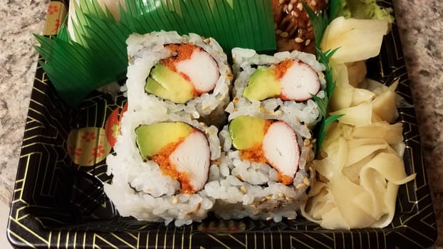 sushi roll with crab and avocado and caviar fish eggs