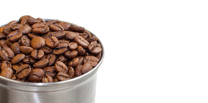 A lot of coffee beans in a metal coffee grinder on a white background. Isolated coffee items