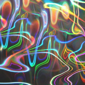 Blurred multi-colored holographic strip disco.Texture or background