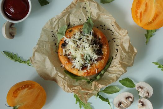 Rustic dish baked bun with fried meat with tomatoes and cheese.Texture or background