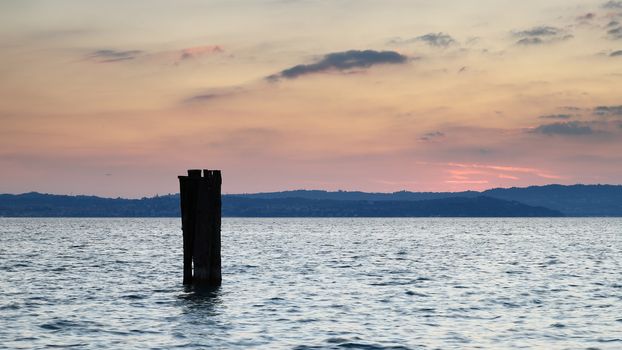 Sunset over Lake Garda in Italy viewed from the Sirmione waterfront.