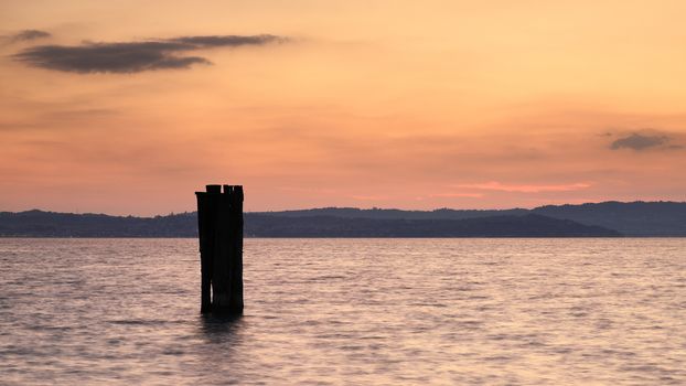 Sunset over Lake Garda in Italy viewed from the Sirmione waterfront.