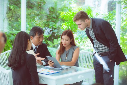 young business people making meeting and talking for analyzing marketing working at office on desk.