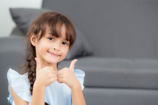 Portrait of beautiful kid, child, girl and hand gesture ok with expression happiness.