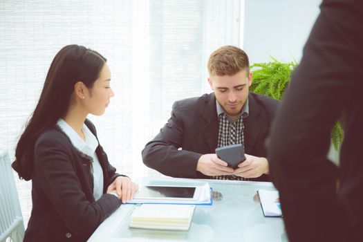 young business people making meeting and talking for analyzing marketing working at office on desk.