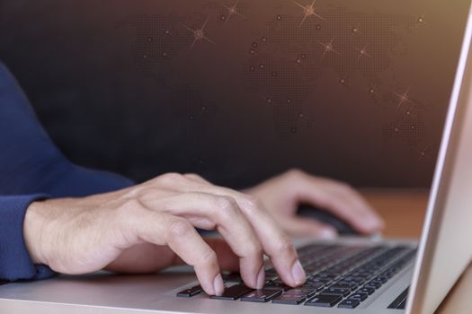 Business and social network concept. Businessman hands with laptop and world map tree graph background. Businessman hands use computer network แontact with customer and partners all the word.
