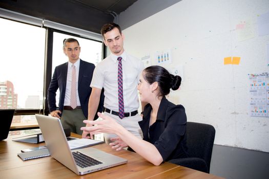 Business team having using laptop during a meeting and presents.