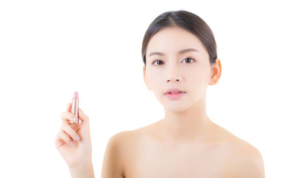 Lips makeup asian woman with lip balm care. Beauty Asian girl 
holding lipstick with happy. cosmetics beauty concept.
