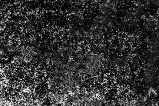 The time-aged textured rough surface of the wall is black and gray . Texture or background.