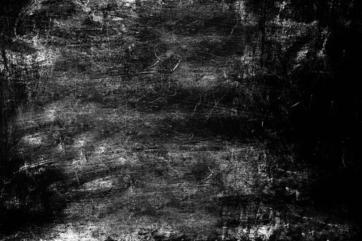 The surface of the wall is rough and heavily scratched black . Texture or background