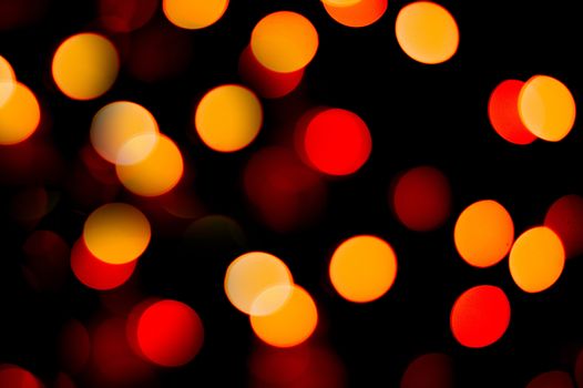 Unfocused Christmas garland of rounded shape with colorful multicolored lights. Background or texture