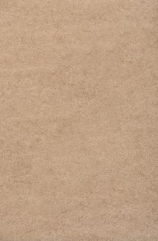 Thin paper base of light brown color. Background or texture