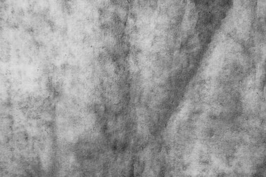 Strongly crumpled black white paper with strongly deformed surface