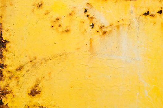 Rusty metal surface with peeling yellow paint.Background.Texture