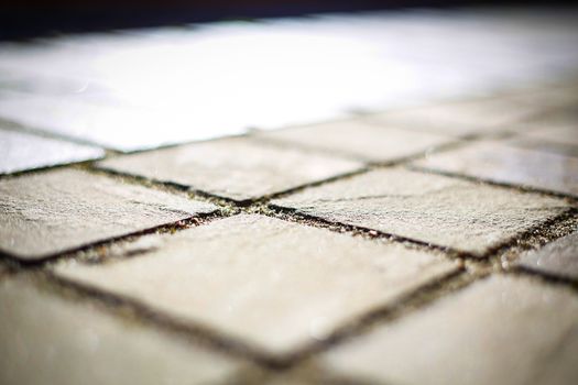 The natural stone element on the road is out of focus .Texture.Background.