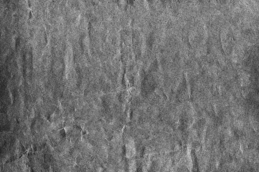 Black and white strongly crumpled background or paper texture