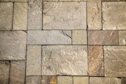 Road pavement natural stone with uneven textured shape on the surface.Texture.Background.