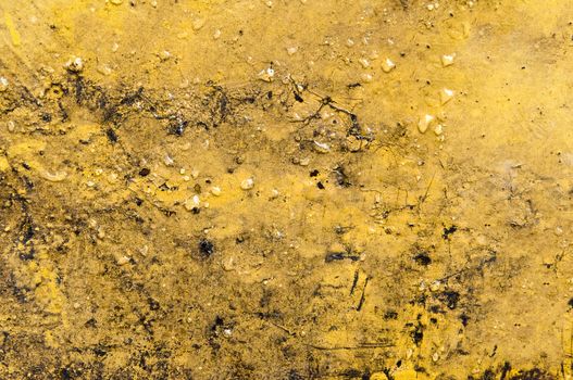 Heavily rusted metal surface yellow in color