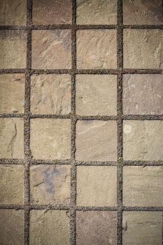 The road is lined with natural stone brown .Texture.Background.