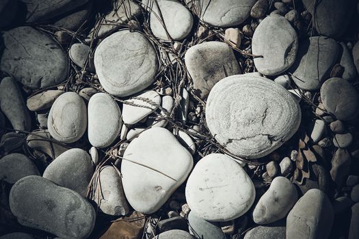 Large sea pebbles with small particles of dirt on the surface.Background.