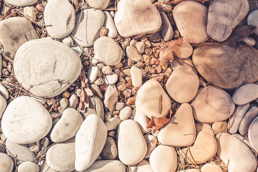 Large sea pebbles on the coast with dirt particles on the surface.Texture.Background.