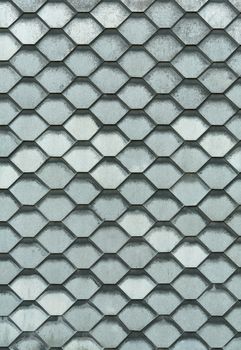 The roof is made of metal plates in the form of honeycombs.Texture or background.