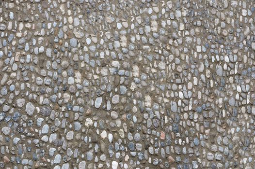 The road is lined with small stones .Texture or background