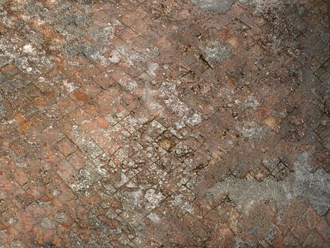 Old dilapidated road lined with square stones .Texture or background.