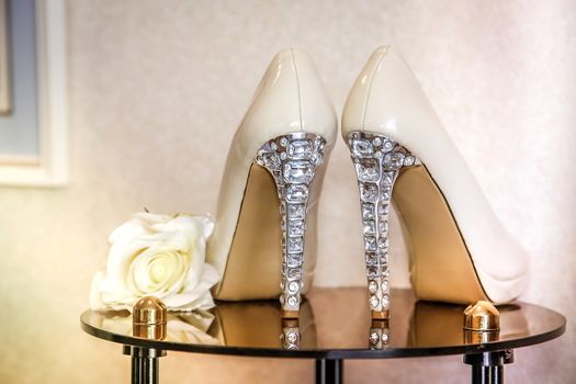 Wedding shoes with high heels decorated with jewelry made of stones