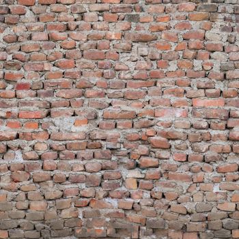 Cracked old red brick wall.Texture or background