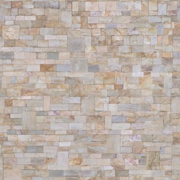 Colorful decorative stone on the wall is made of different parts .