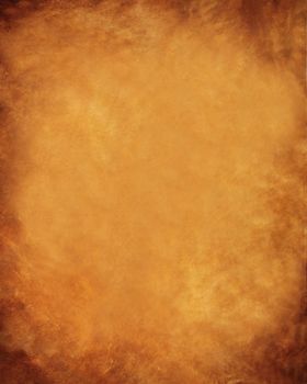 Aged parchment paper yellow brown with burnt edges and spots .Textures or background