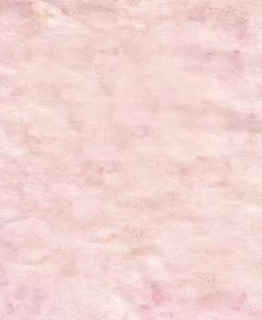 Pink paper with uneven crumpled surface and spots .Texture or background