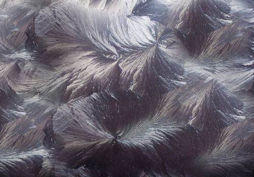 A frost pattern is applied to the metallic surface of the blue shade .Texture or background