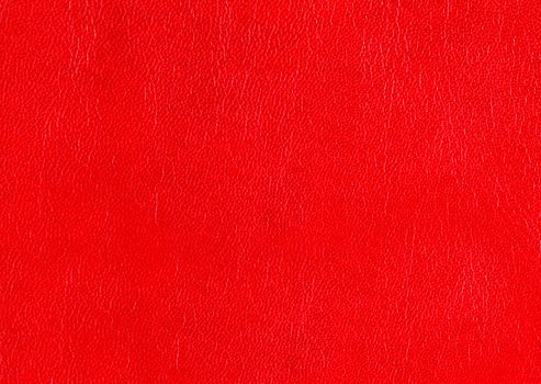 Natural red leather for upholstery with rough textured surface.Texture or background