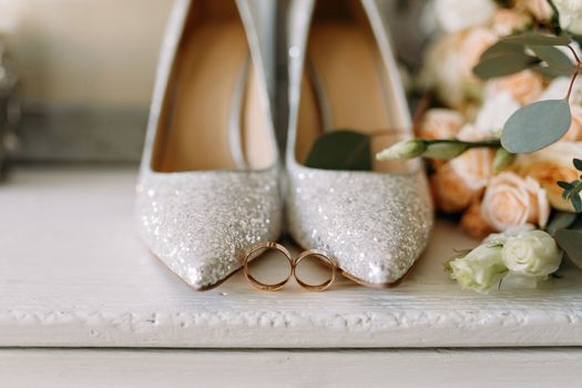 Wedding shoes and wedding paraphernalia, wedding bouquet, wedding gold rings