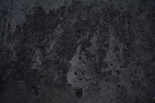 Abstract dark grey marble with a crack in the corner