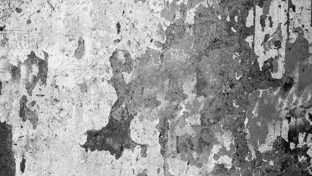 An abstraction of an old dilapidated concrete wall with a black spot