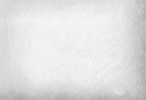 A sheet of plain white paper with a crumpled surface
